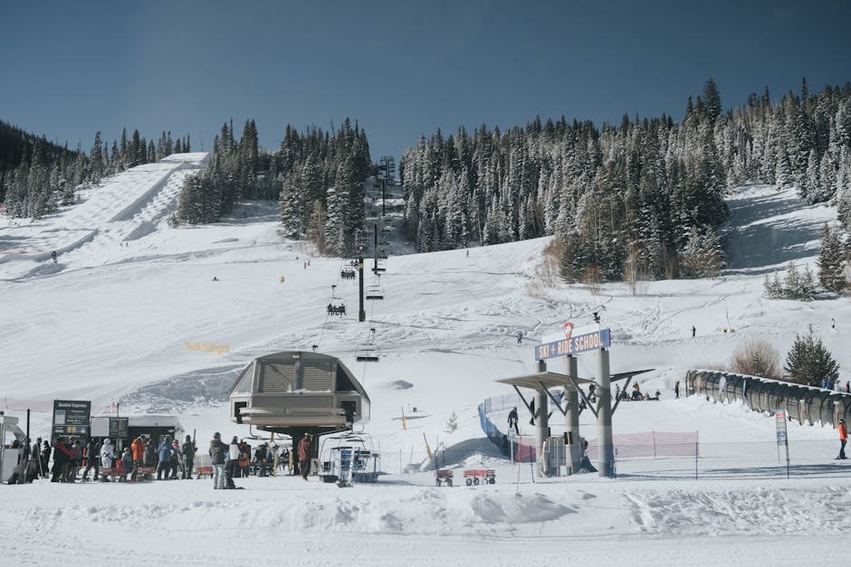 Aspen Mountain in USA - a group of people standing on top of a snow covered slope.