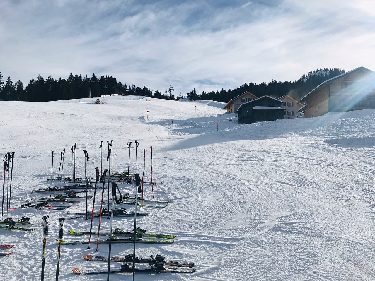 Krähenberg – Sibratsgfäll in Austria - a bunch of ski equipment in the snow.