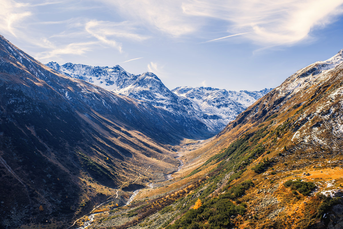Homberg in Switzerland - a view of a valley with mountains in the background.