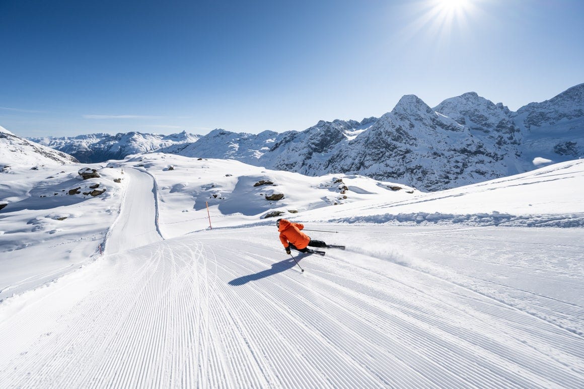 Diavolezza Lagalb in Switzerland - a person skiing down a snow covered mountain.