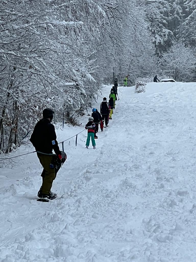 Eisenberg – Neuenstein in Germany - a group of people walking down a snow covered hill.