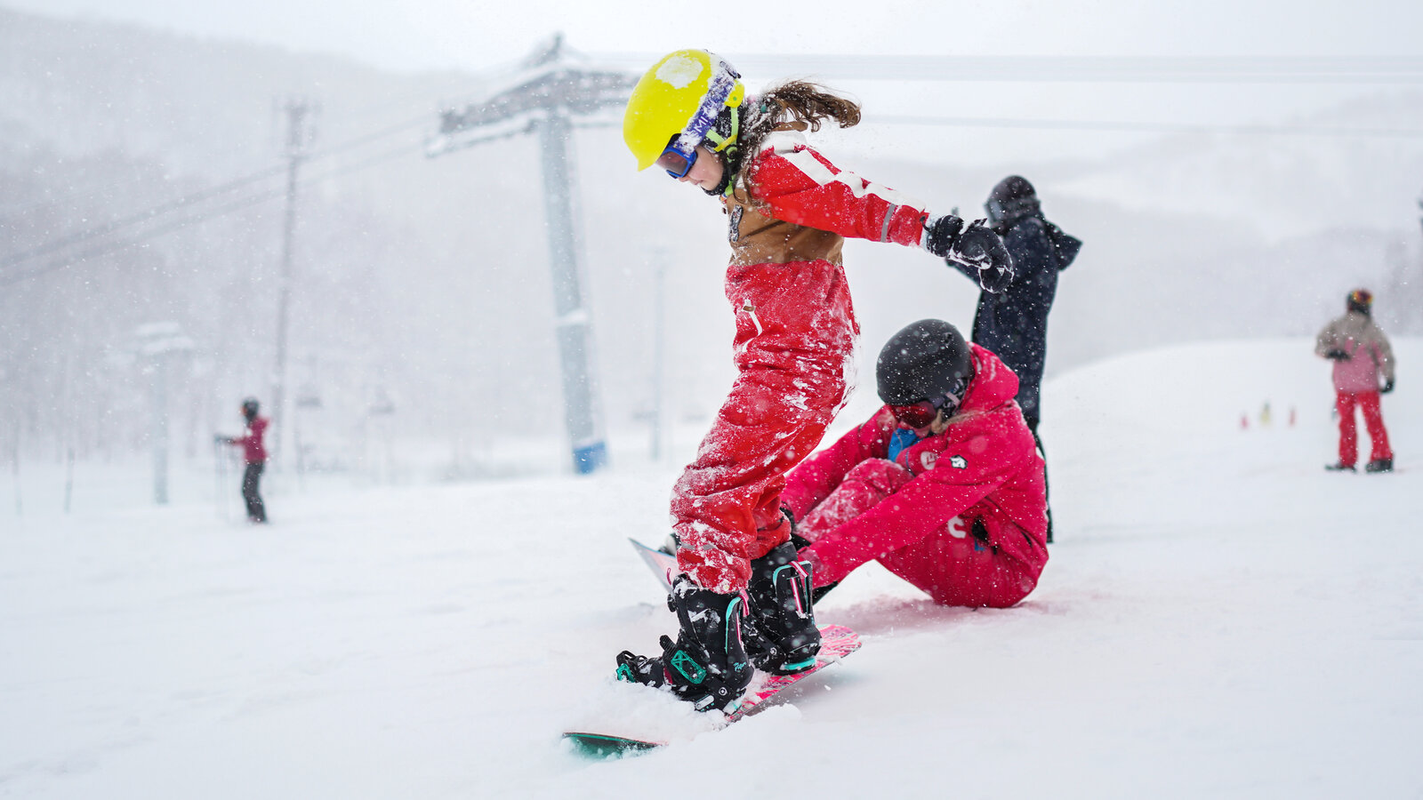Blanche Takayama in Japan - a group of snowboarders in the snow.