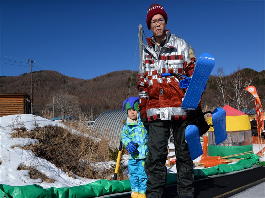 Blanche Takayama in Japan - a man holding a snowboard.