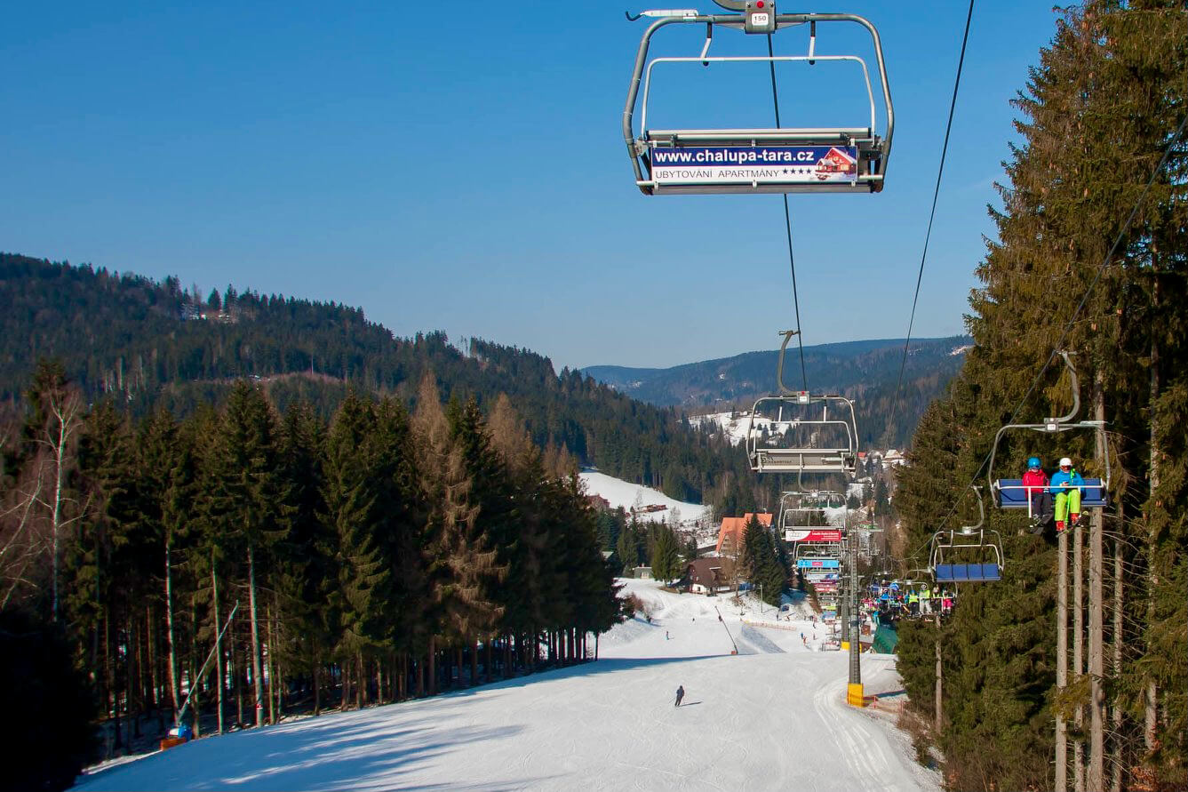 Ski areál U Čápa in Czech Republic - a ski lift going up a snowy slope.