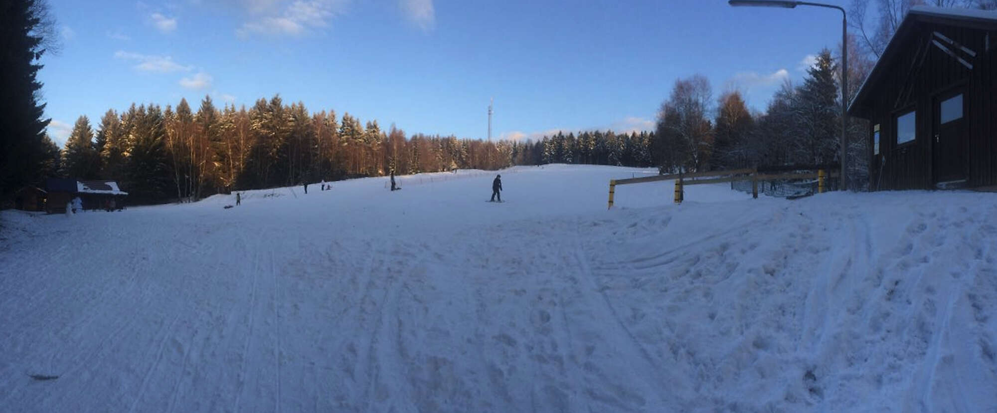 Schorrberg – Bad Marienberg in Germany - a person is skiing down a snowy hill.