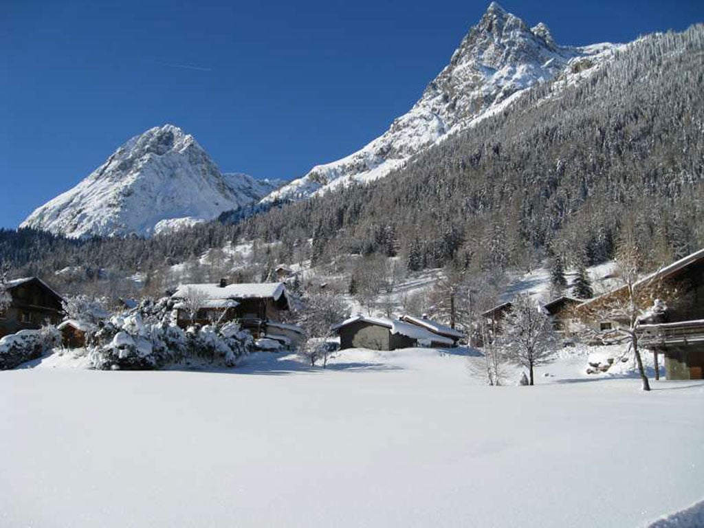 La Poya – Vallorcine in France - a snowy landscape with mountains in the background.
