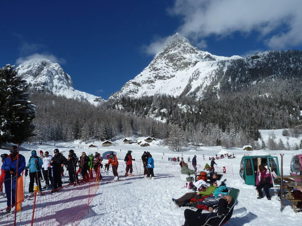 La Poya – Vallorcine in France - a group of people skiing down a snowy slope.