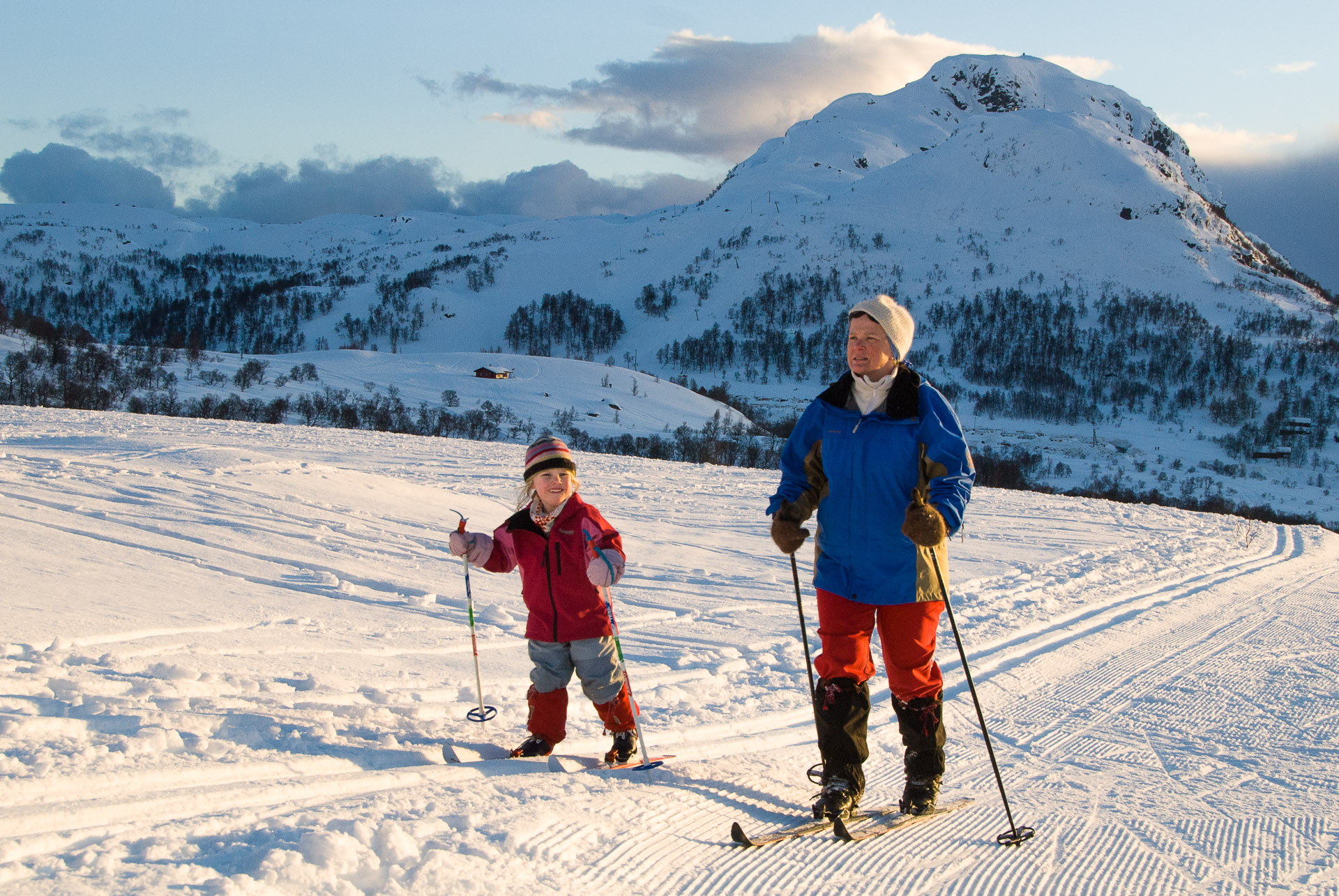 Gullingen in Norway - a man and a child on skis in the snow.