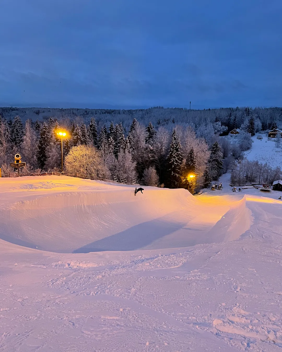 Talma in Finland - a snow covered ski slope at night.