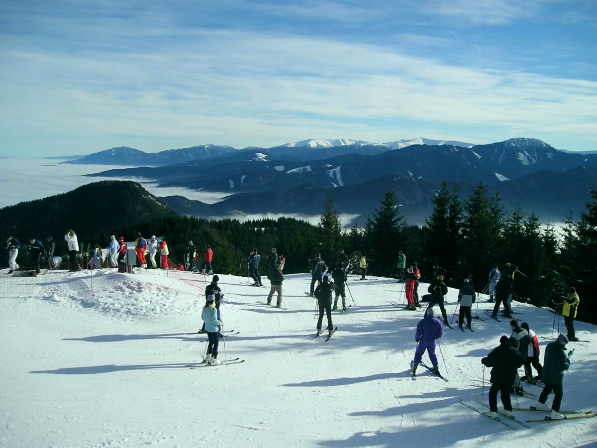 Veľké Ostré in Slovakia - a group of people skiing down a mountain.