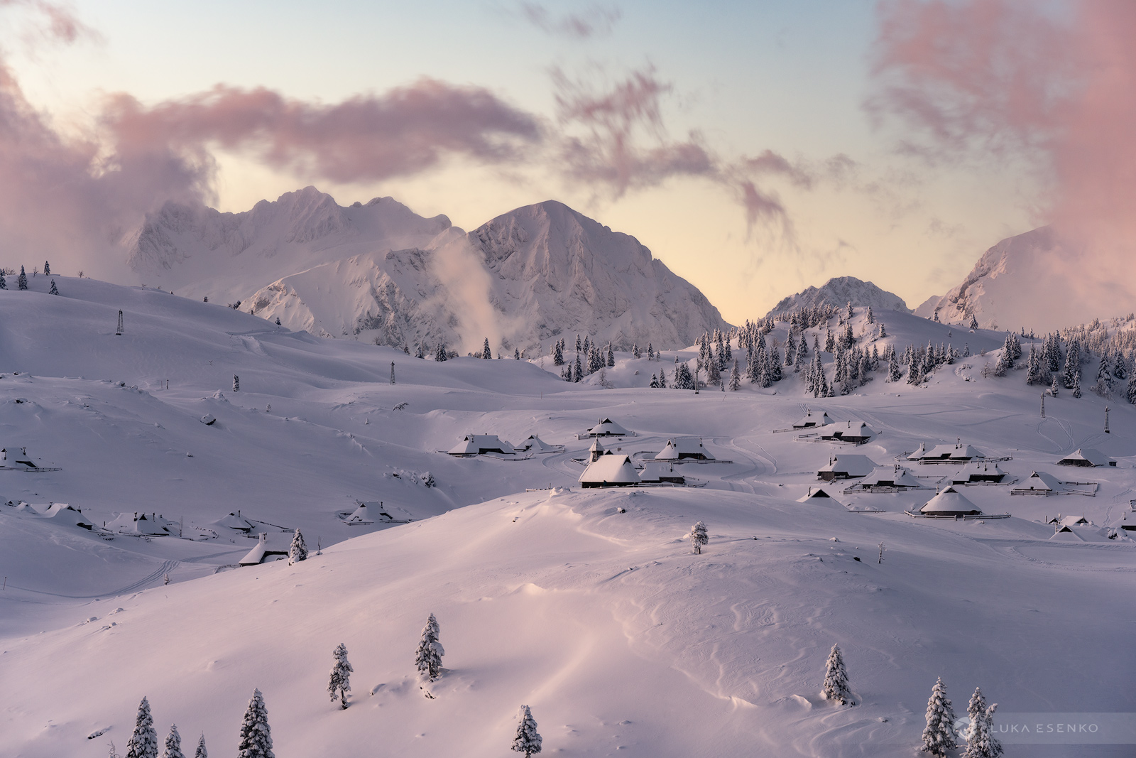 Jalovec in Czech Republic - a snowy landscape with a mountain range in the background.