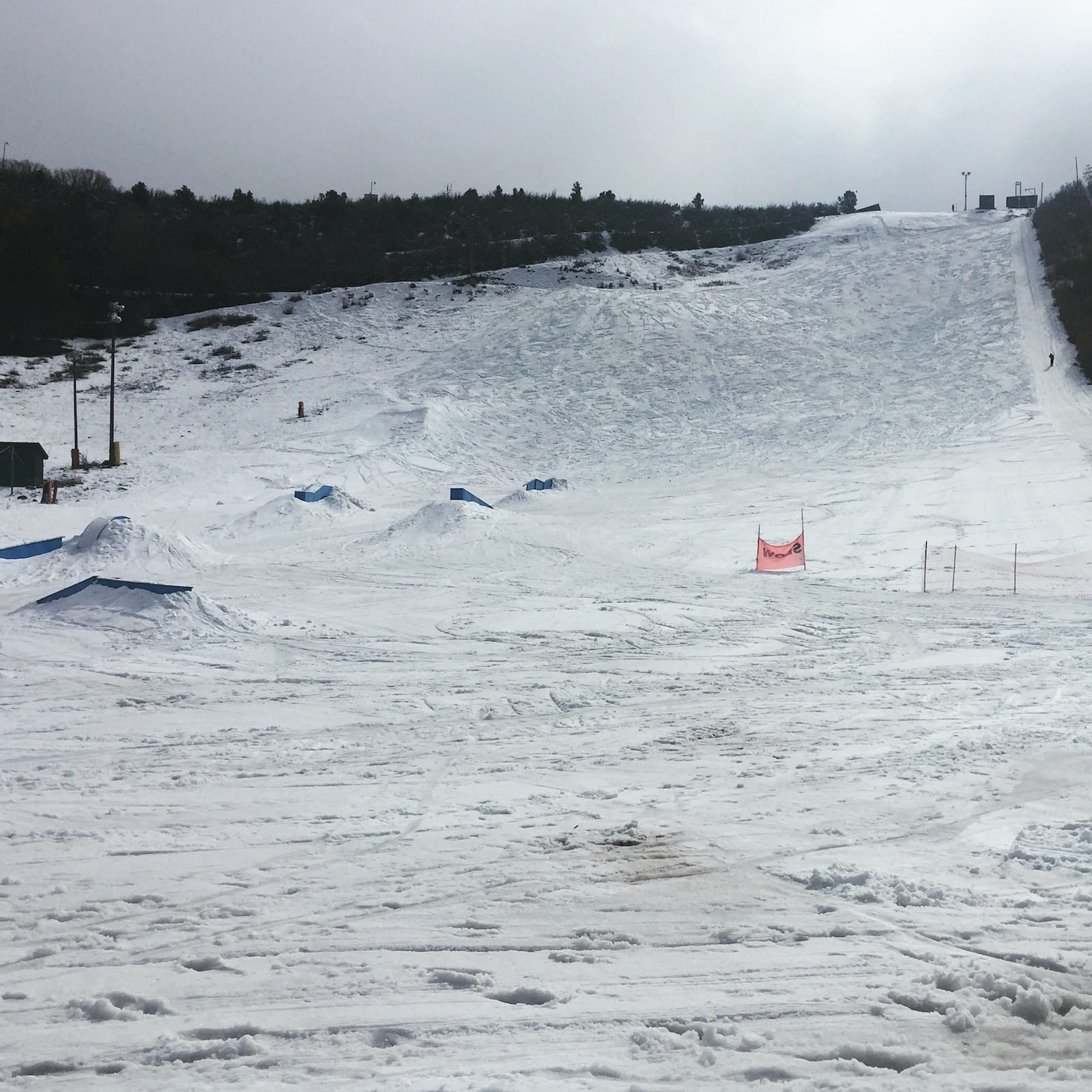 Winter sports enthusiasts at Chapman Hill, Durango, Colorado, enjoying the snowy slopes at a ski resort with a charming chalet in the backdrop.