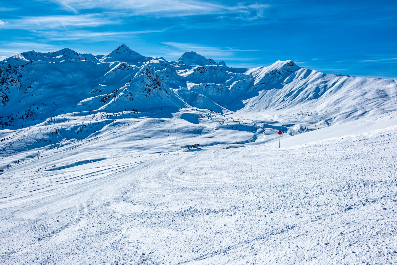 Bormio – Cima Bianca in Italy - a person skiing down a snow covered mountain.