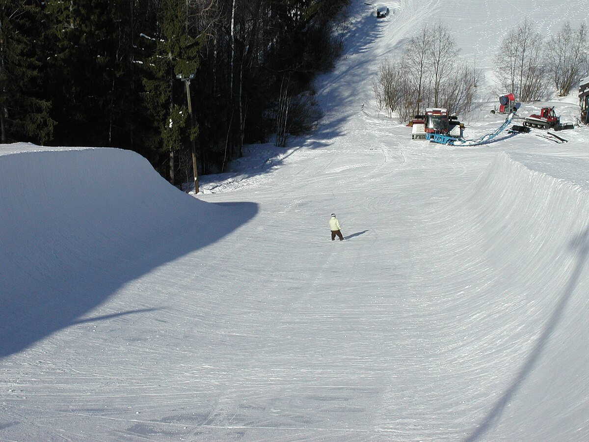 Savivuori – Viitasaari in Finland - a person riding a snowboard down a hill.
