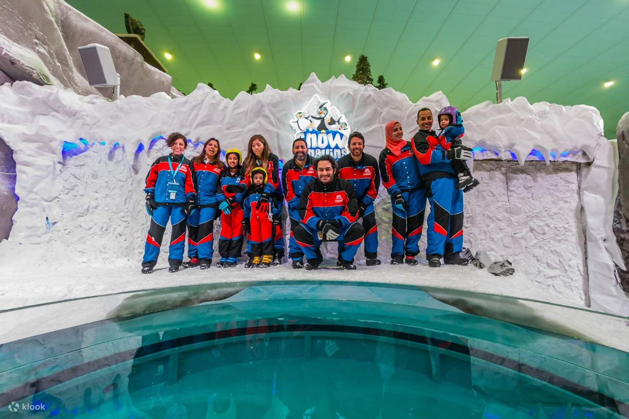 Ski Egypt in Egypt - a group of people posing for a photo in front of an ice sculpture.