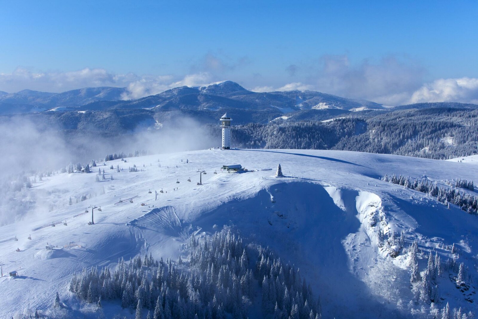 Feldberg – Seebuck | ​Grafenmatt | ​Fahl in Germany - a view from the top of a snowy mountain.