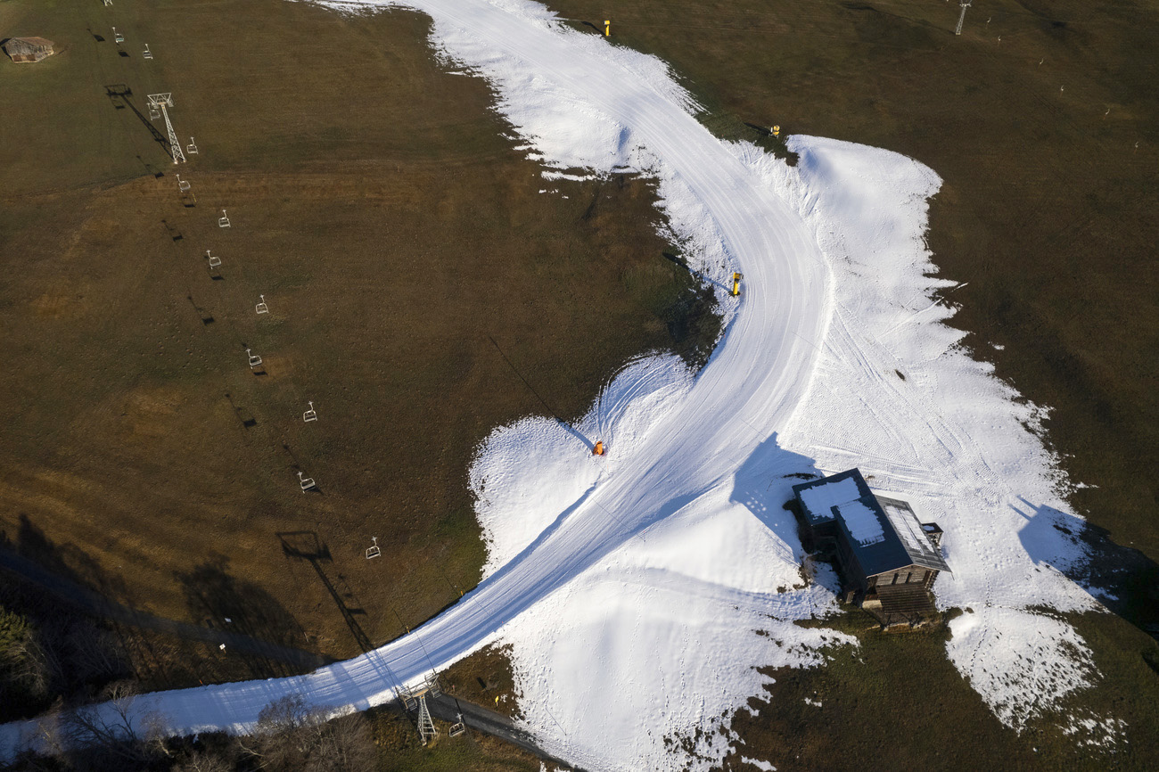 Splügen – Tambo in Switzerland - an aerial view of a snow covered road.