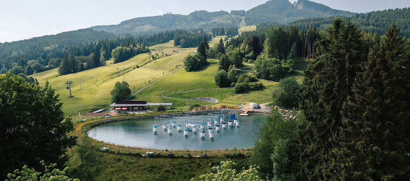 Nesselwang – Alpspitze in Germany - a small pond in the middle of a mountain.