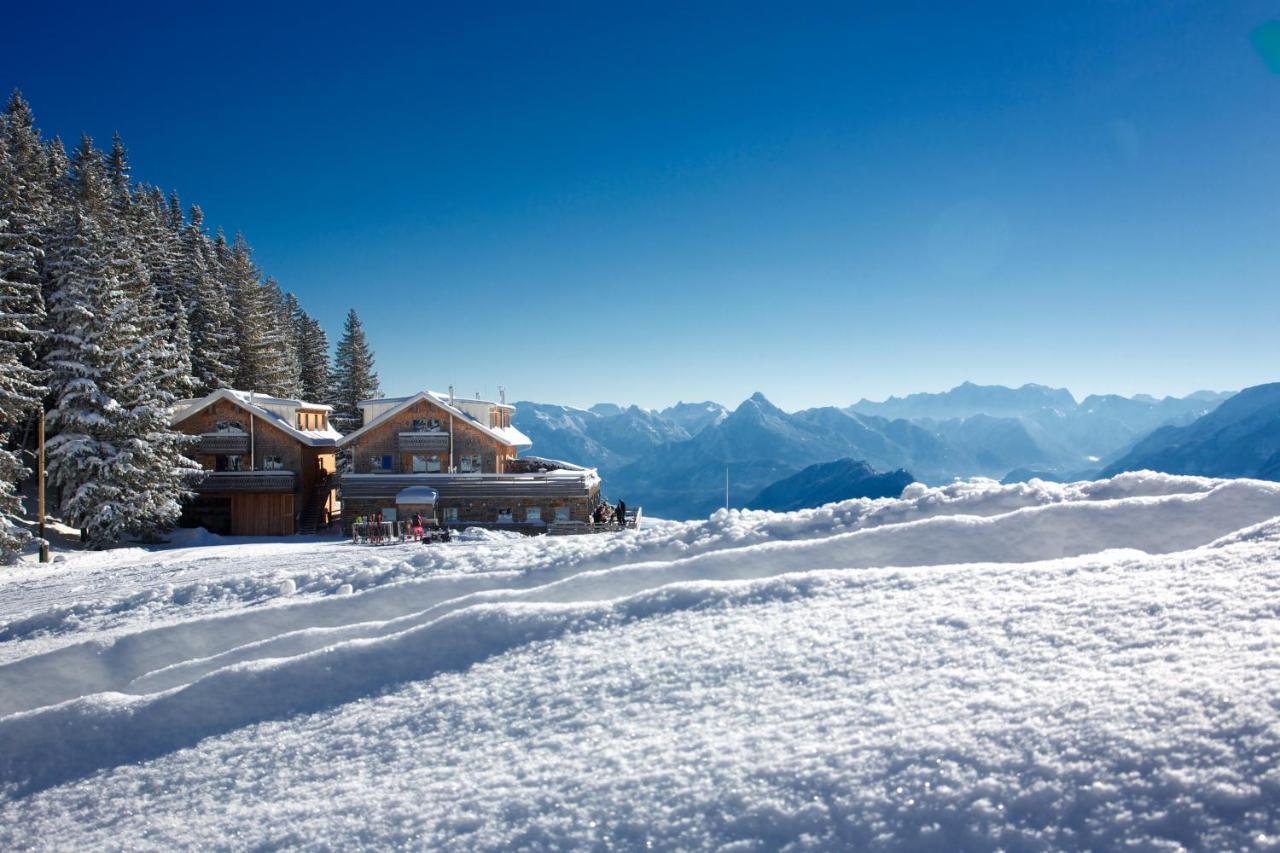 Nesselwang – Alpspitze in Germany - a house in the mountains covered in snow.