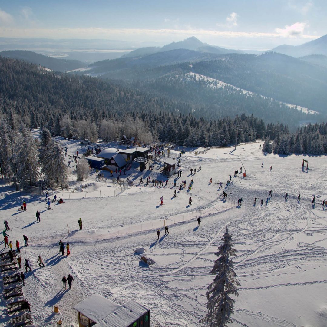 Jakubkova Lúka in Slovakia - a group of people skiing down a snowy slope.