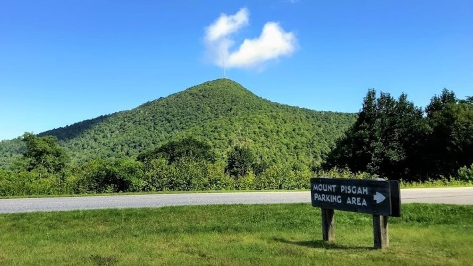 Mt Pisgah in USA - a sign on the side of a road in the mountains.