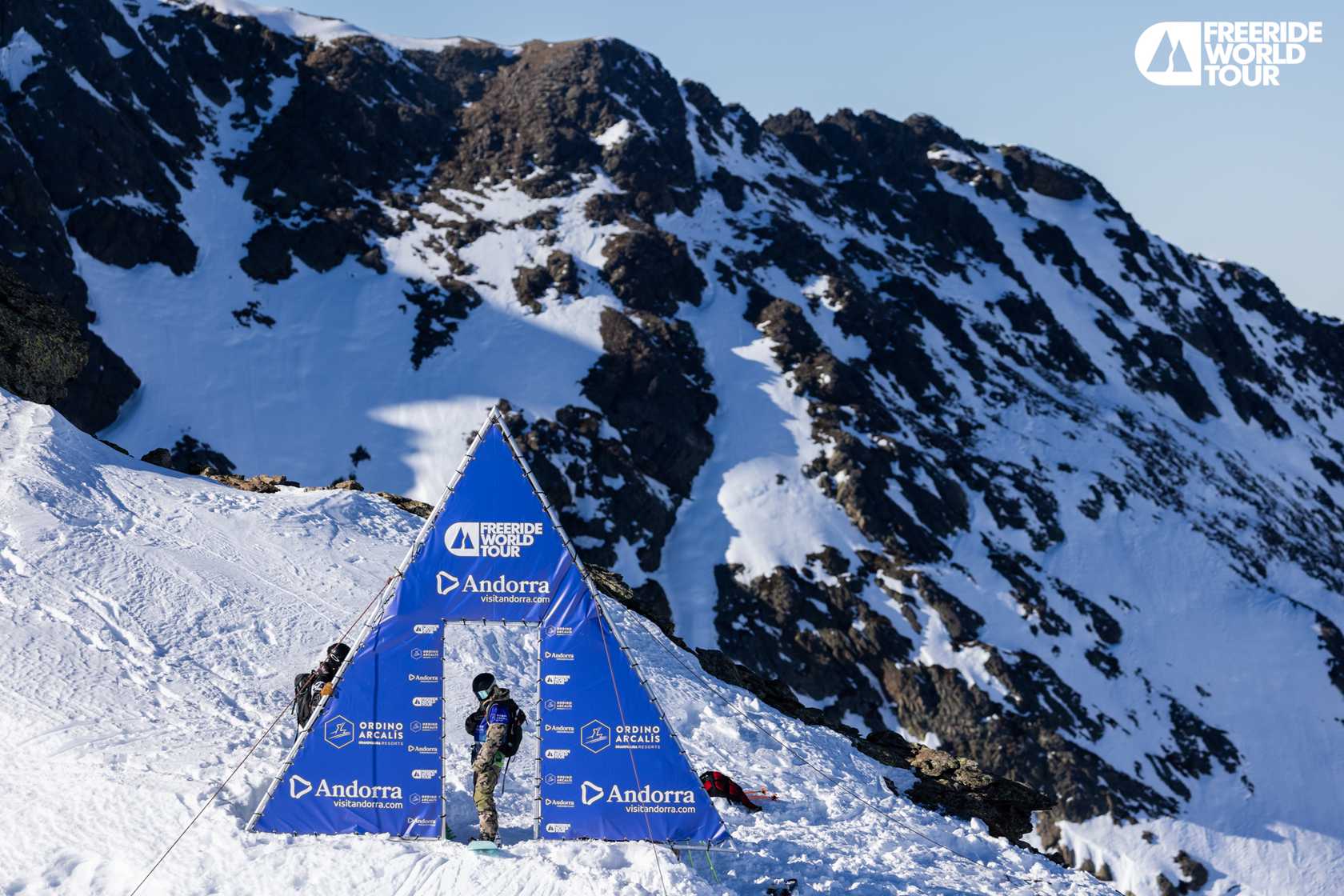 Ordino Arcalís in Andorra - a group of people climbing up a snow covered mountain.