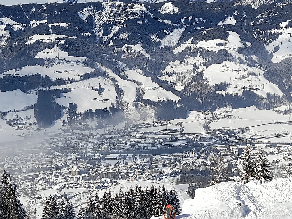 Hahnbaum – St Johann im Pongau in Austria - a group of people skiing down a mountain.