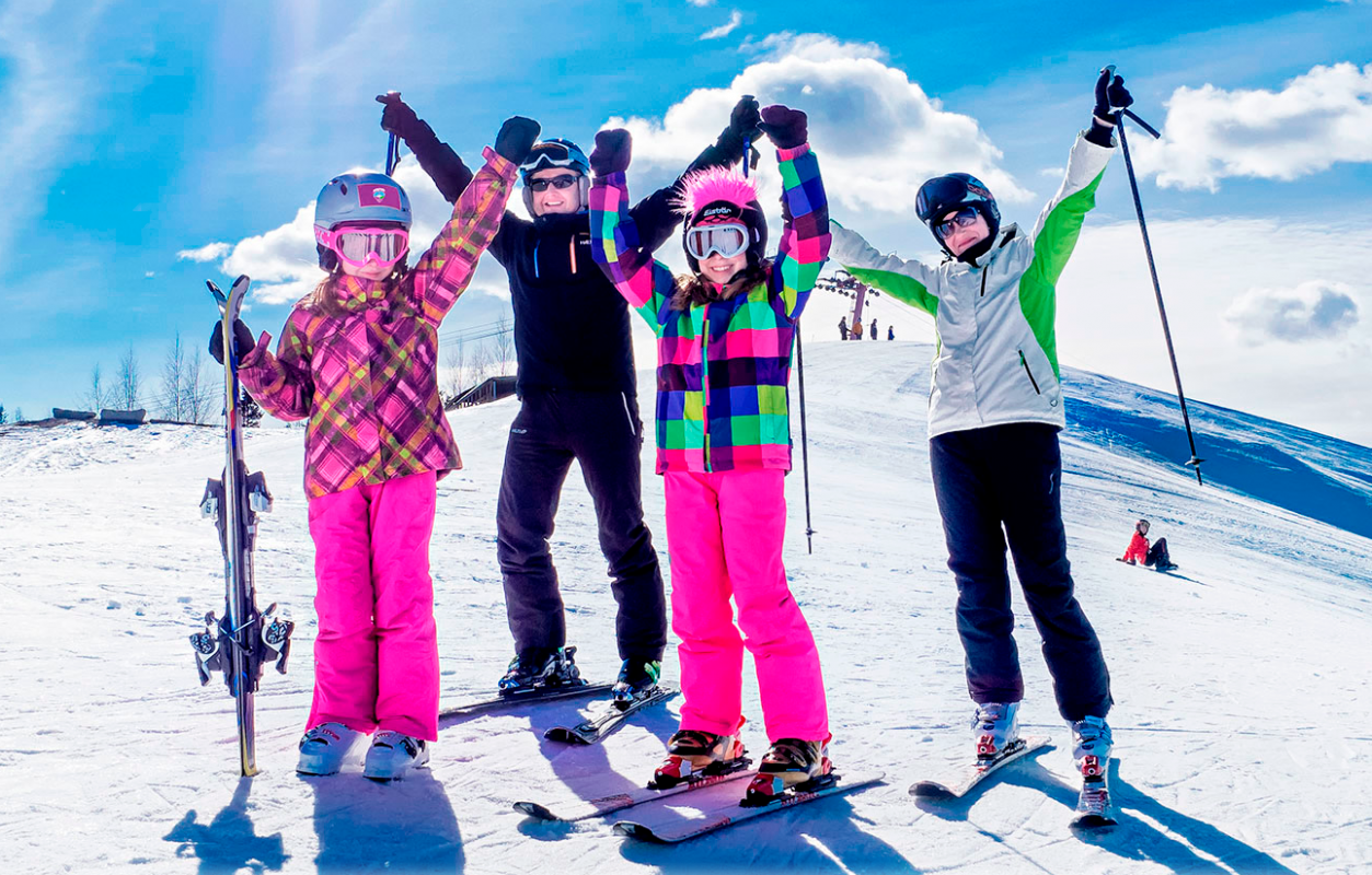 Simpsiö in Finland - a group of people standing on top of a ski slope.
