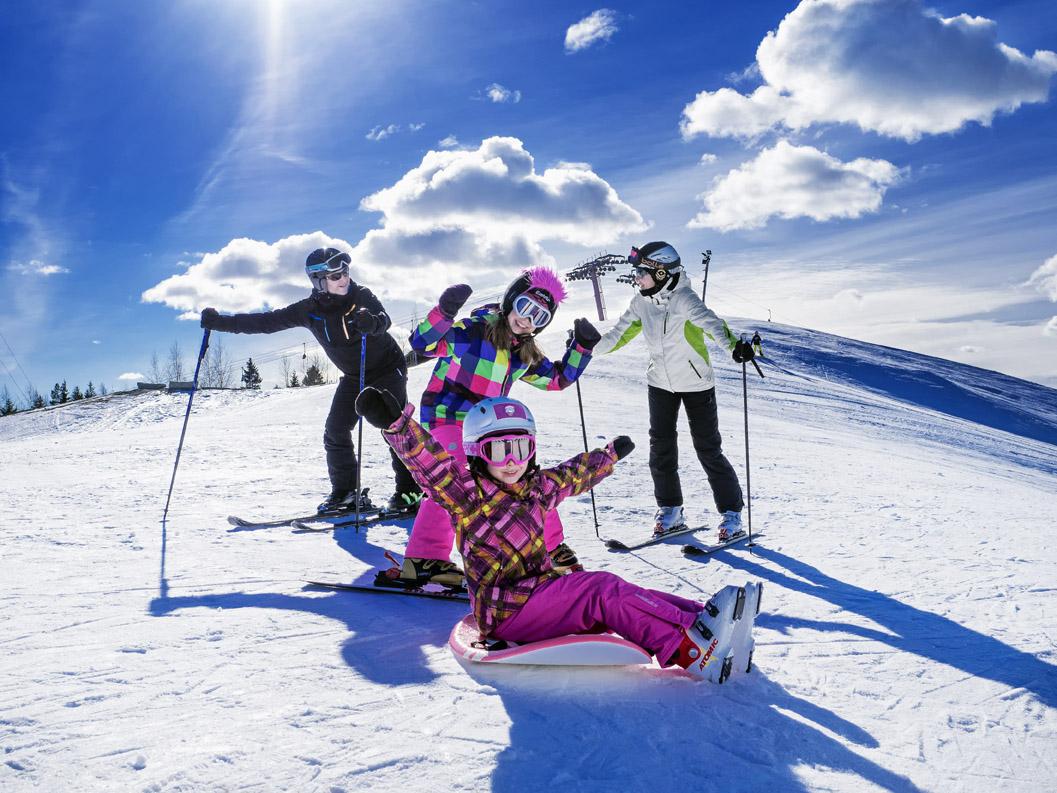 Simpsiö in Finland - a group of skiers on a snow covered mountain.