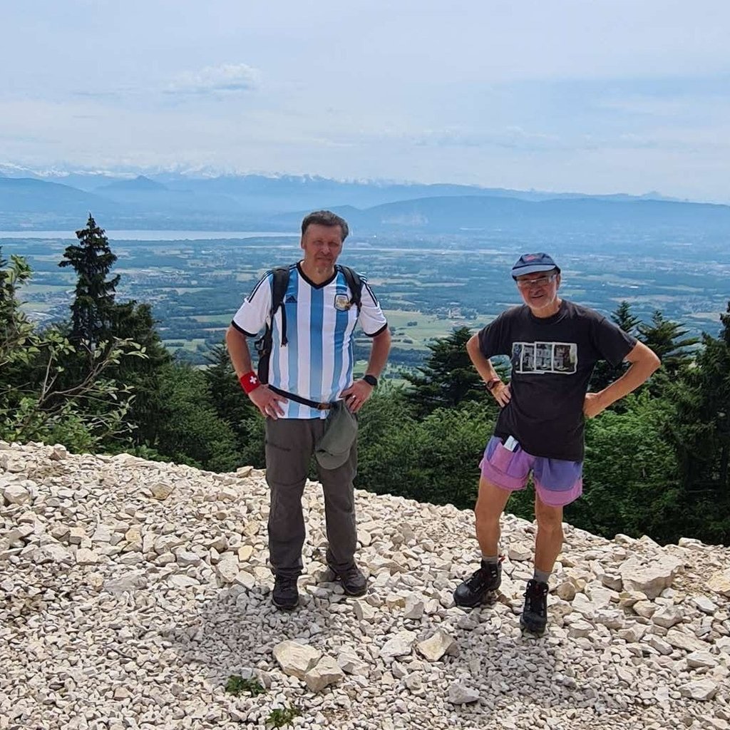 Le Col du Feu – Lullin in France - two men standing on top of a mountain.