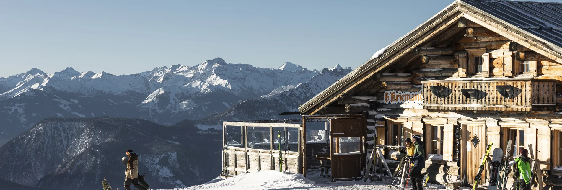 Bacherleitn – Weißenbach bei Liezen in Austria - a group of people standing in front of a mountain house.