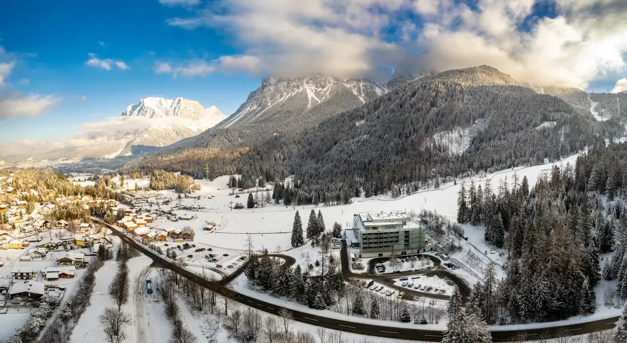 Karlift – Heiterwang in Austria - an aerial view of a snowy village in the austrian alps.