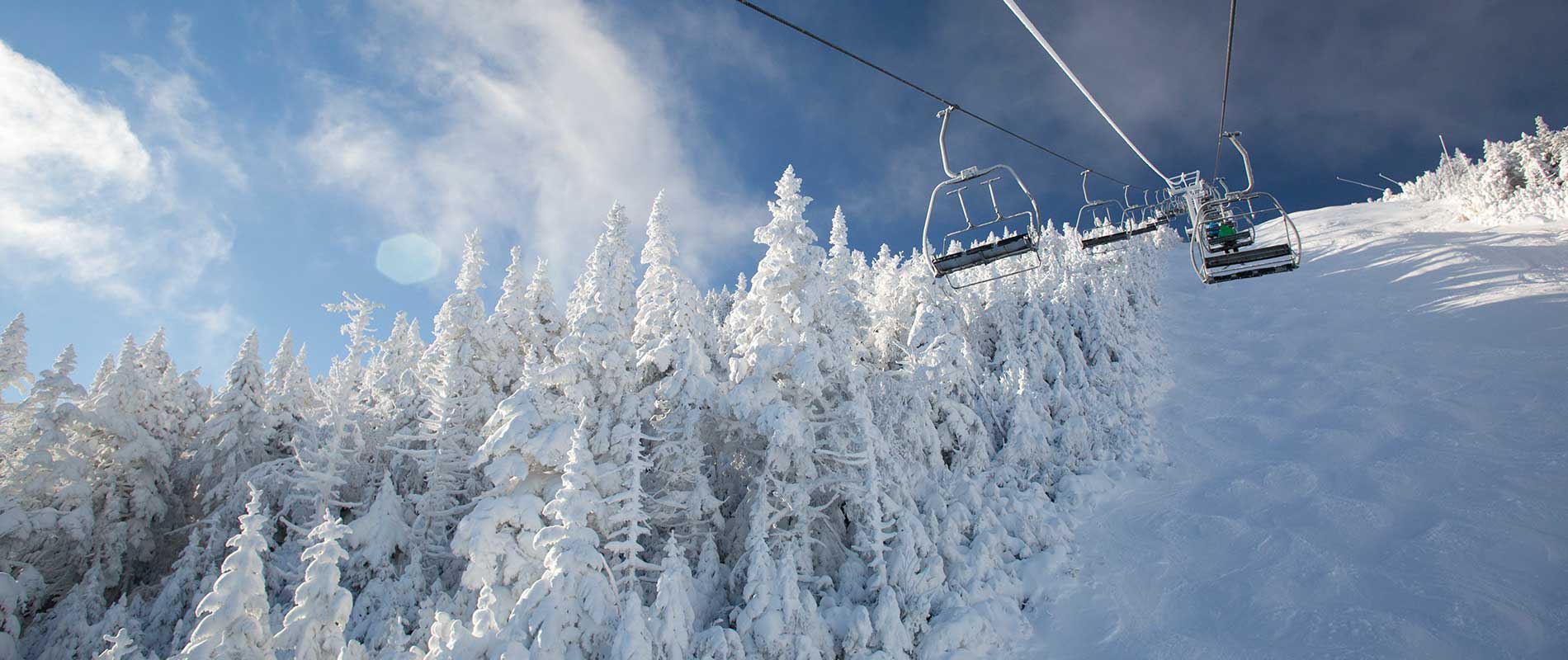 Sugarbush Resort in USA - a ski lift going up a snowy mountain.