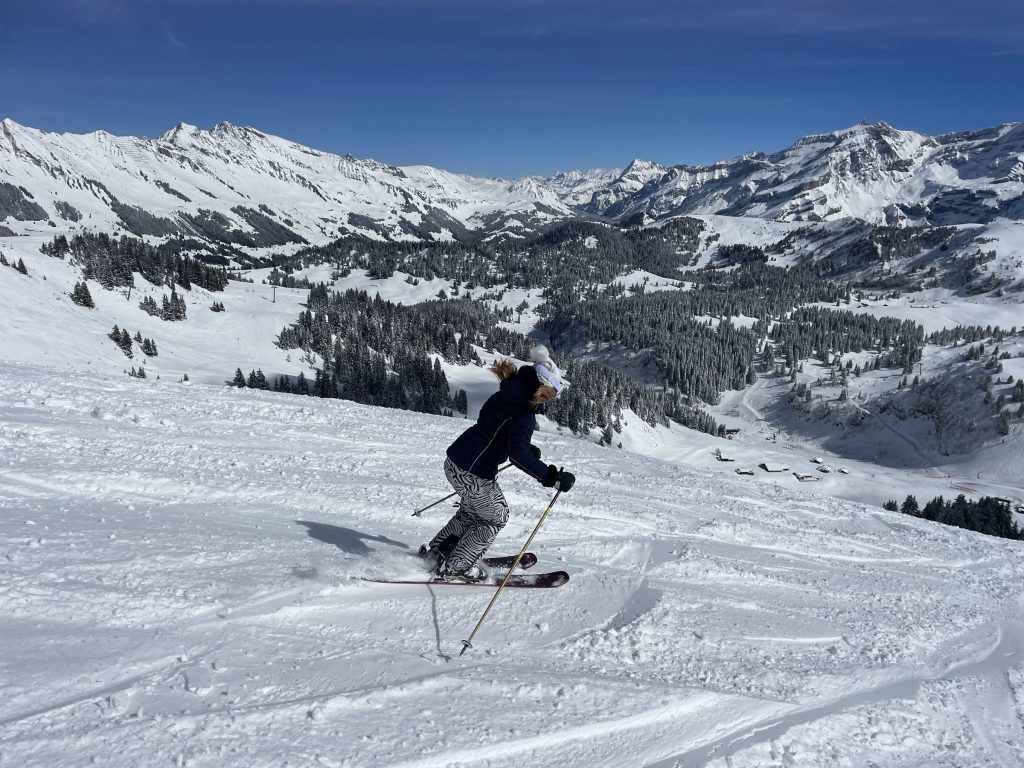 Villars Gryon Diablerets in Switzerland - a person skiing down a snow covered mountain.