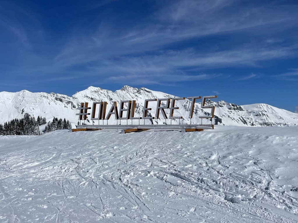 Villars Gryon Diablerets in Switzerland - a sign on the side of a snowy mountain.