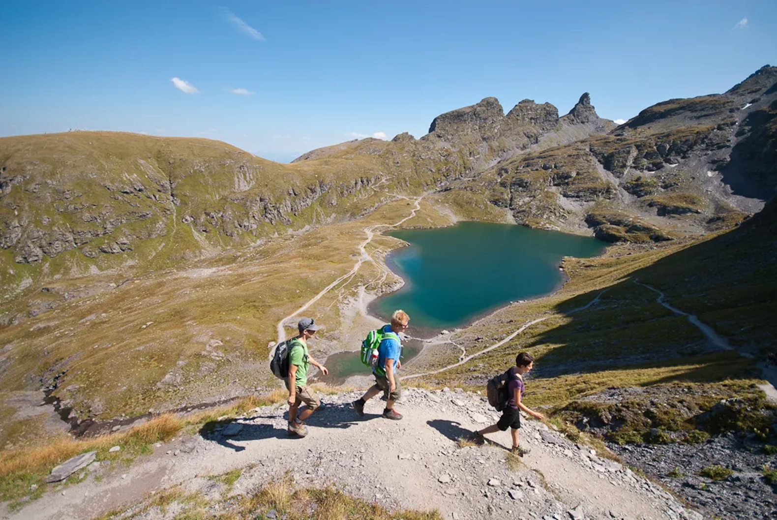 Tristeli – St Margrethenberg in Switzerland - a group of people walking up a mountain.