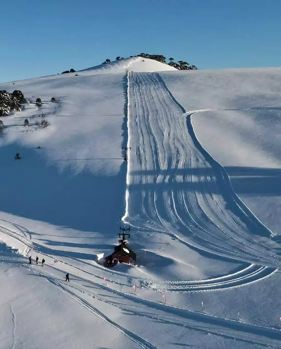 Batea Mahuida in Argentina - a ski slope covered in snow on a sunny day.