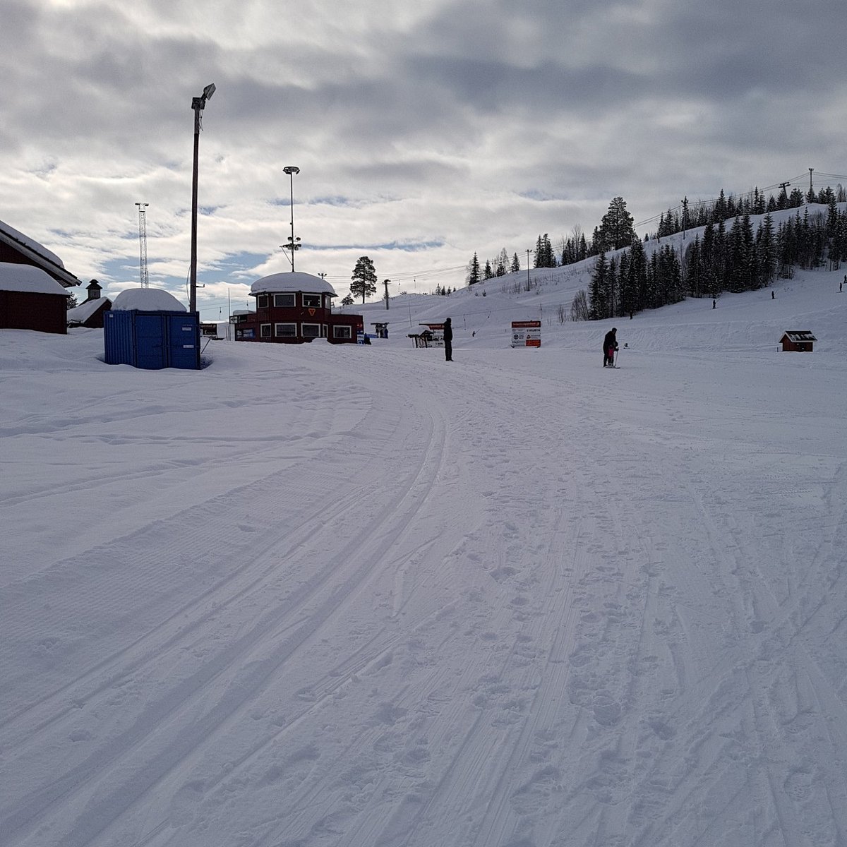 Skillevollen – Mo i Rana in Norway - a person is skiing down a snowy hill.