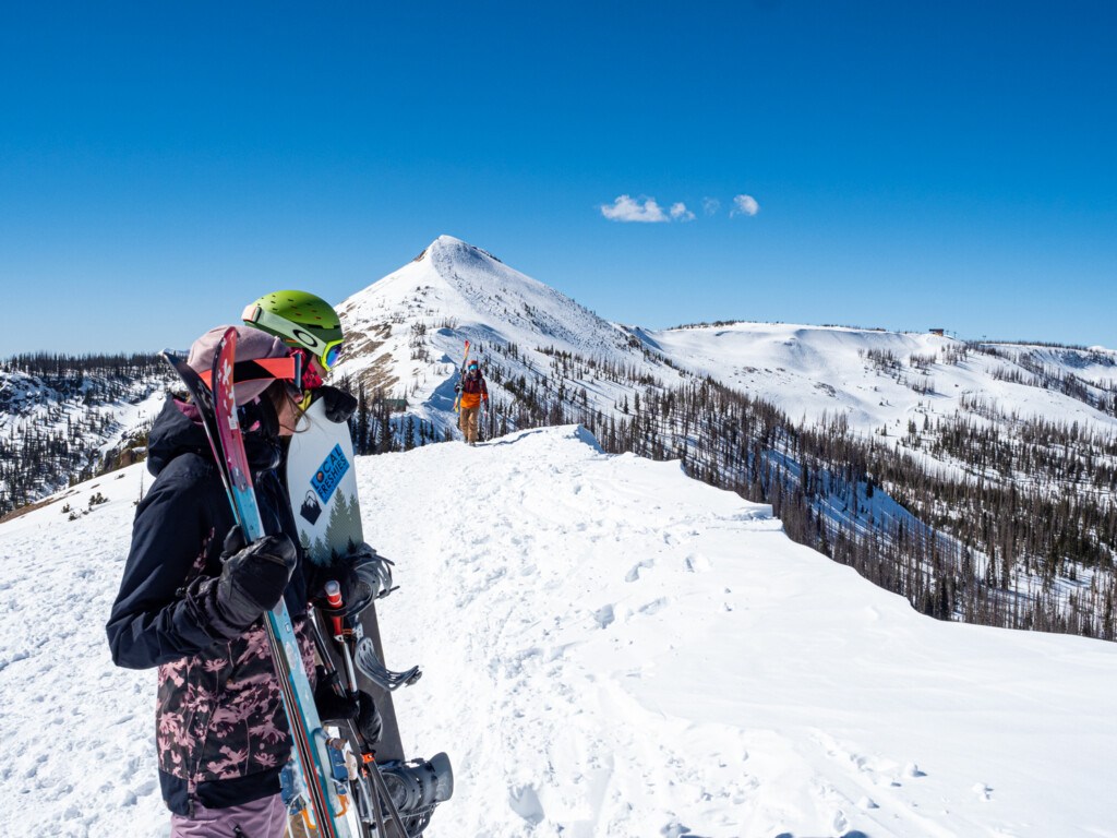 Wolf Creek in USA - a person standing on top of a snow covered mountain.
