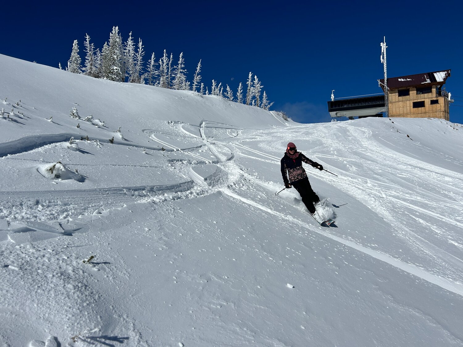 Wolf Creek in USA - a person skiing down a snow covered hill.