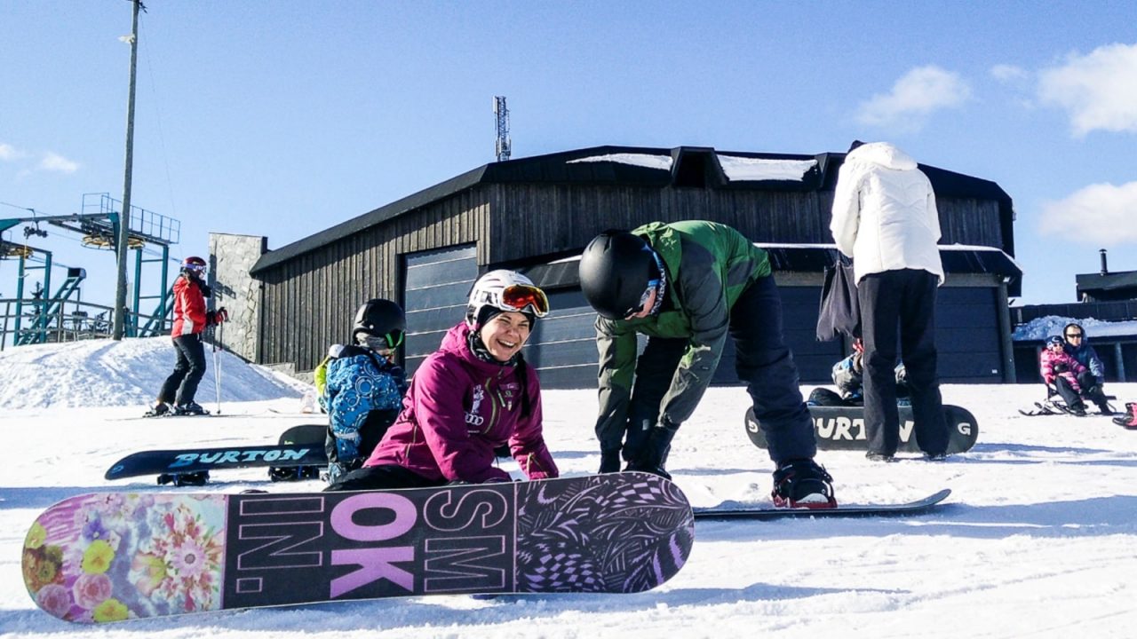 Äänemäki – Äänekoski in Finland - a group of people standing around a snowboard.
