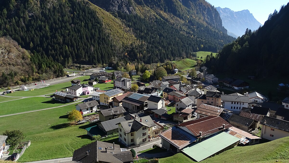 Campo Blenio in Switzerland - an aerial view of a small village in the mountains.