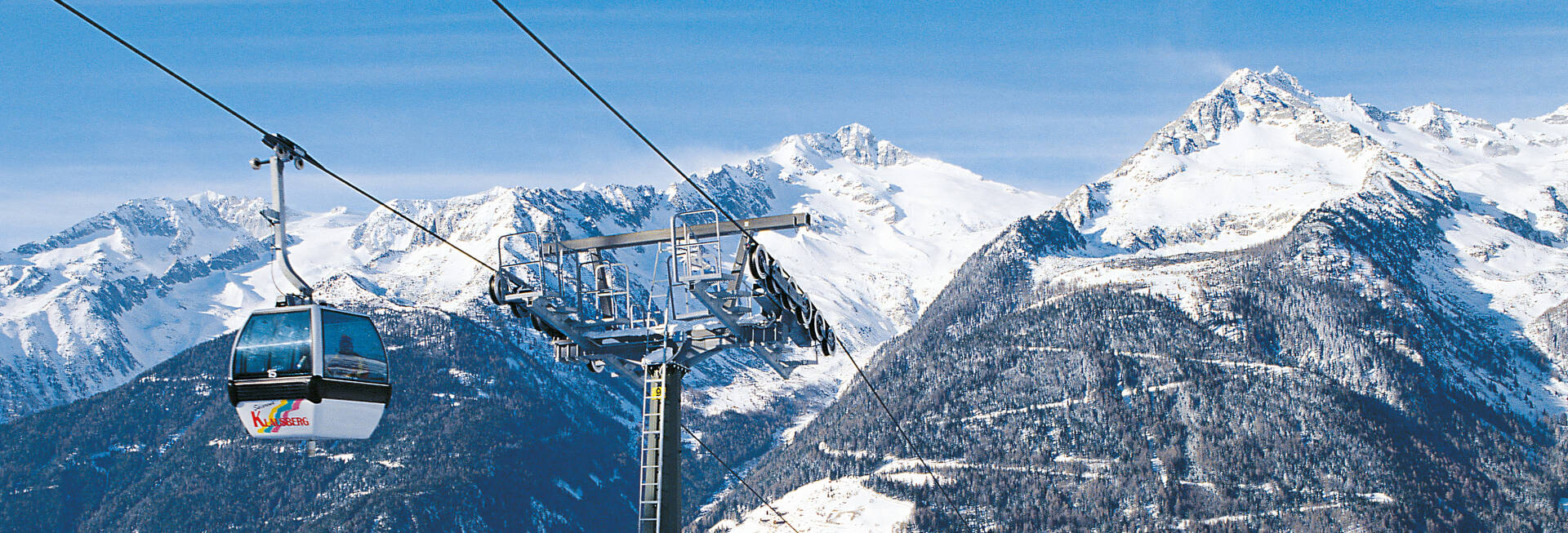 Gasse – Ridnaun in Italy - a ski lift going up a snowy mountain.