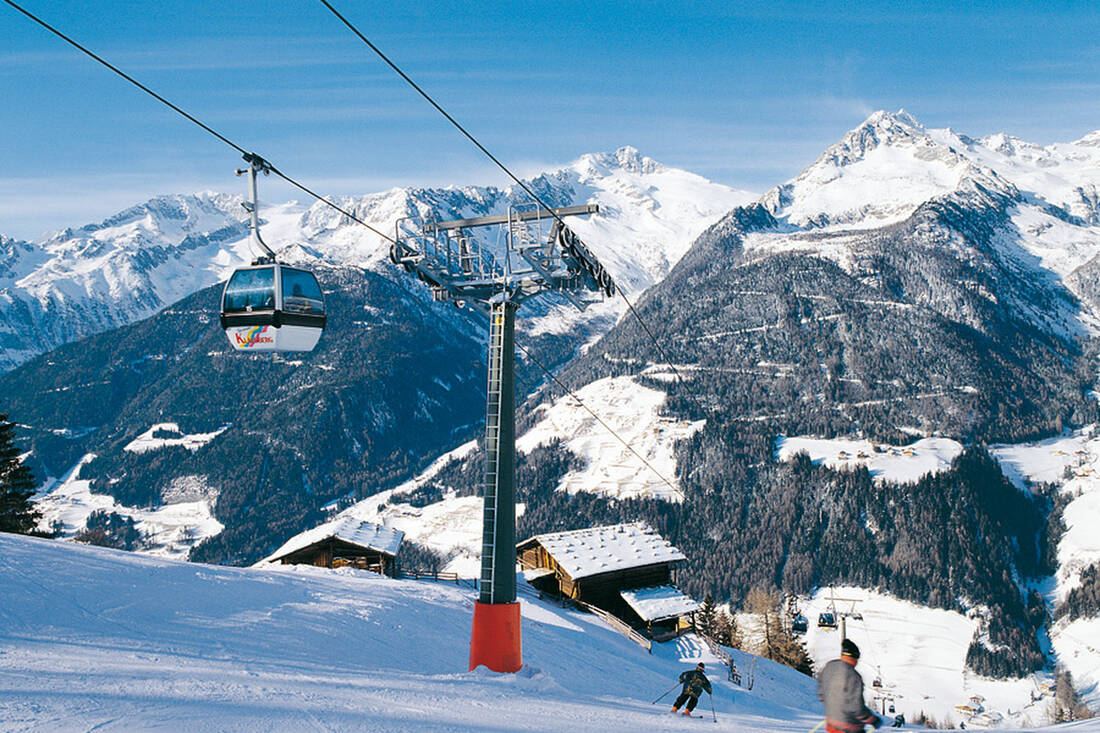 Gasse – Ridnaun in Italy - a ski lift going up a snowy mountain.