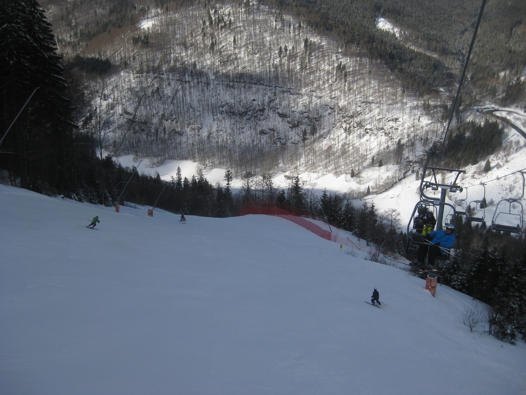 Dobellifts – Schönwald im Schwarzwald in Germany - a person riding a ski board down a snowy slope.