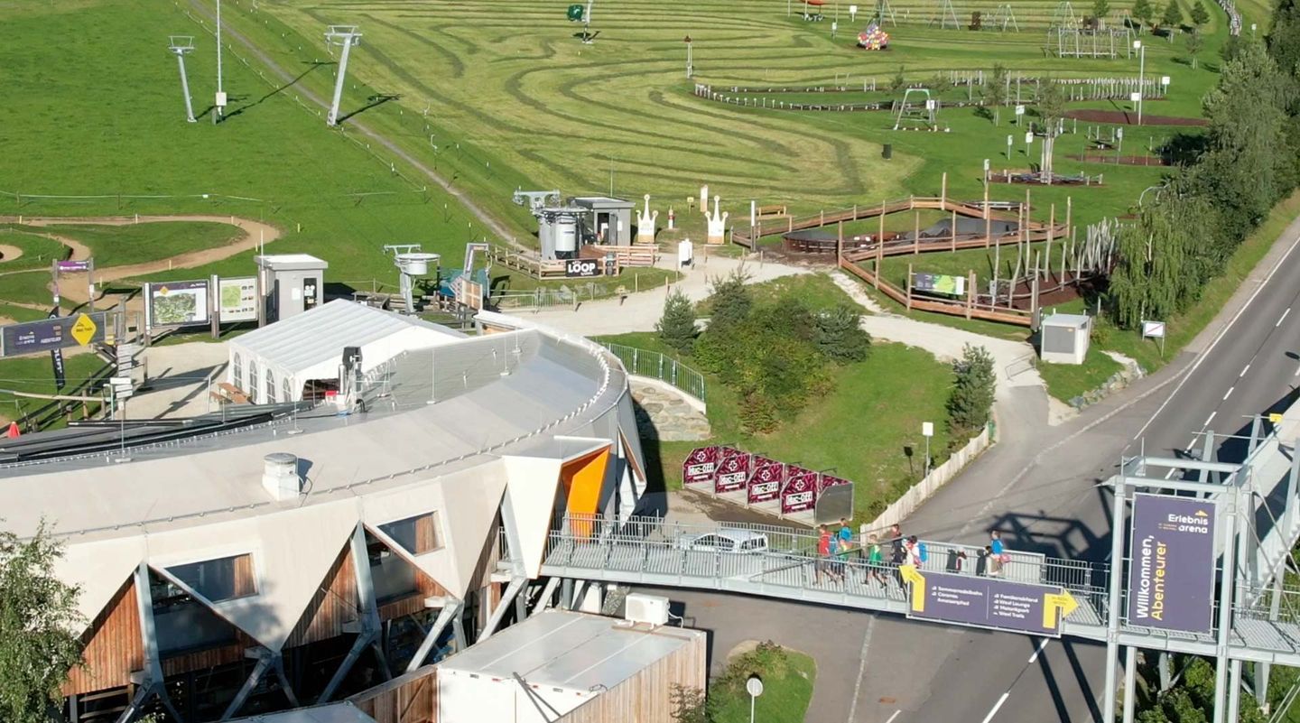 Wexl Arena – St Corona am Wechsel in Austria: a view from the top of a building in a park.