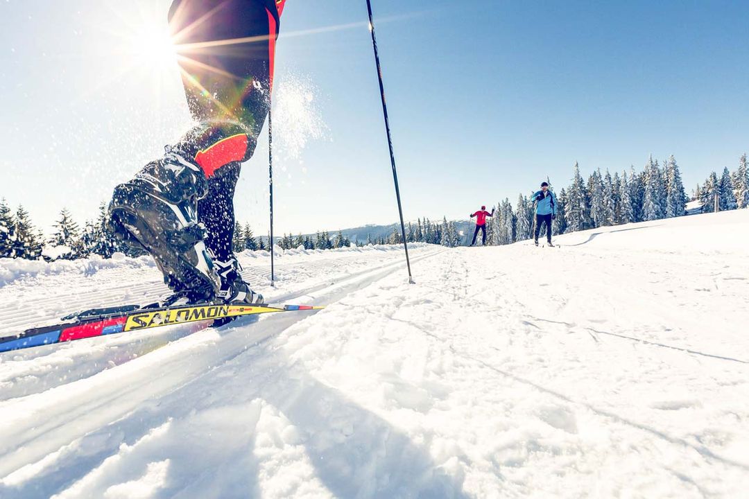 Wexl Arena – St Corona am Wechsel in Austria - a person riding skis down a snowy slope.