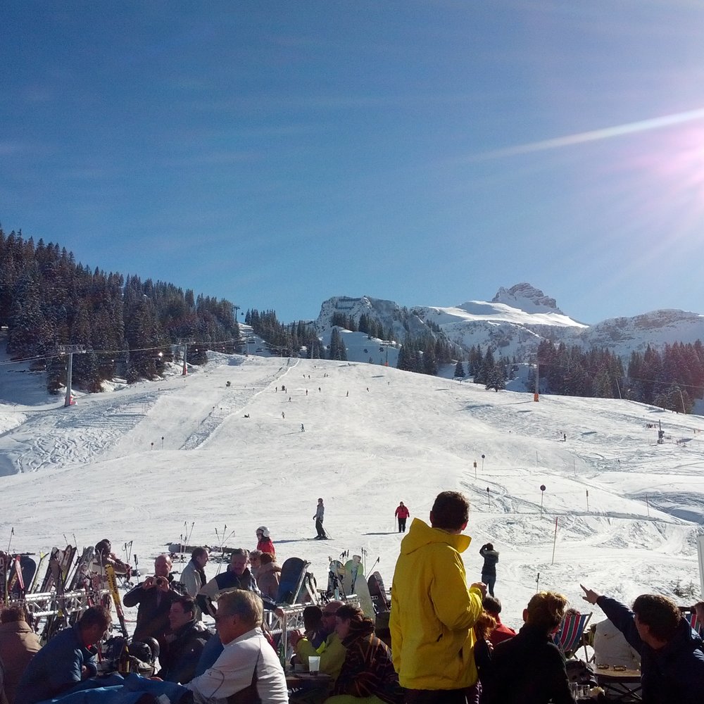 Herrenschwand in Germany - a group of people sitting in the snow.