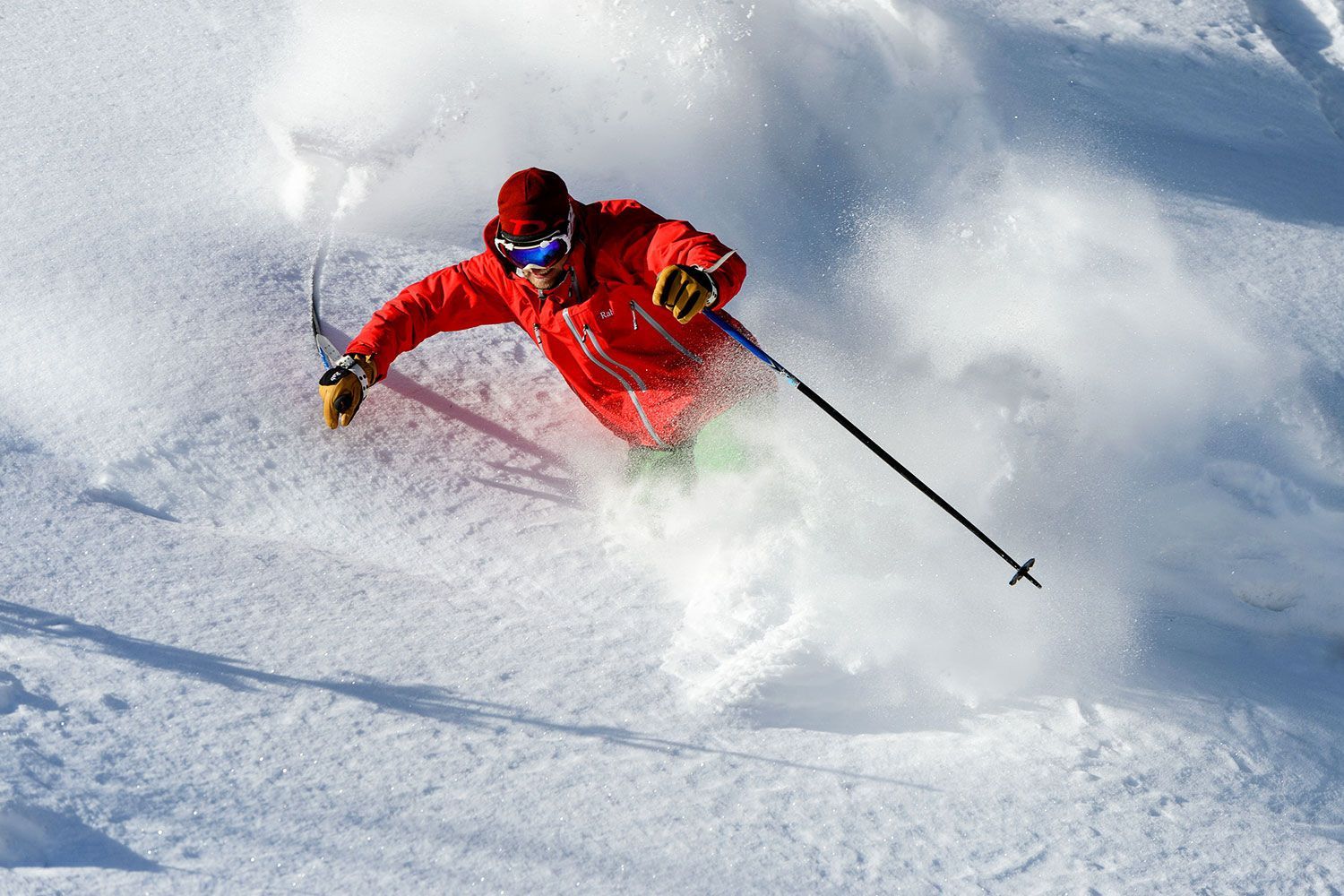Angel Fire Resort in USA - a person in a red jacket skiing down a hill.