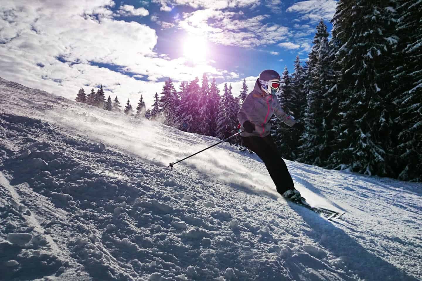 Kassjöbacken in Sweden - a person riding skis down a snowy slope.